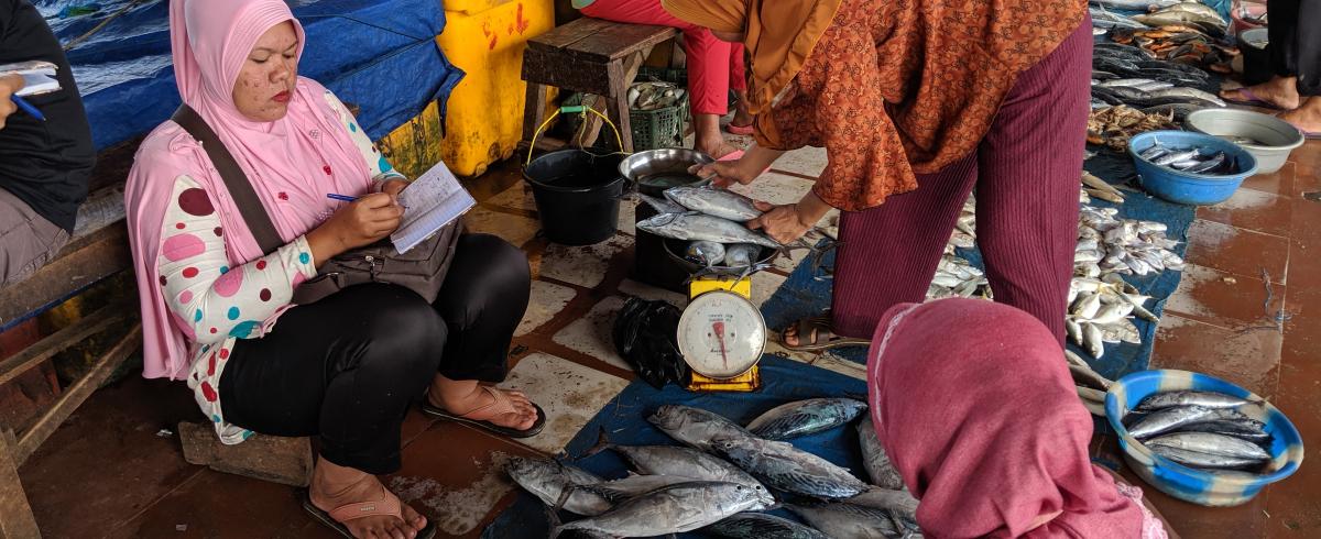 Writing an invoice at the fish market
